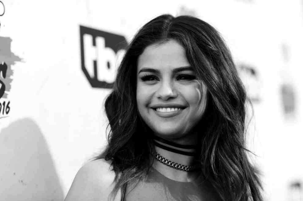 Selena Gomez in front of TBS background (in black and white)