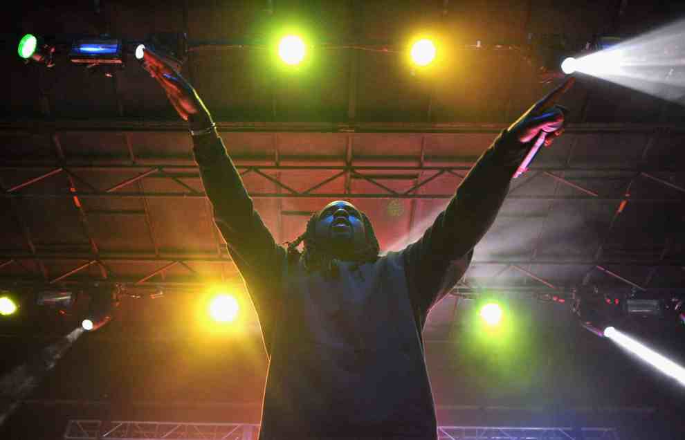 Wale performing with both hands raised above head