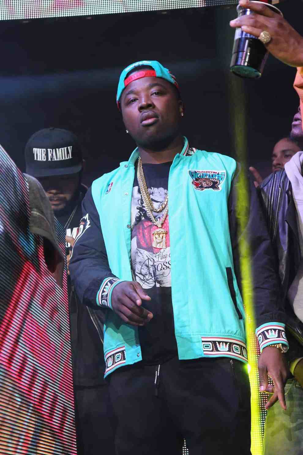 Troy Ave in Vancouver Grizzlies jacket walking through crowd