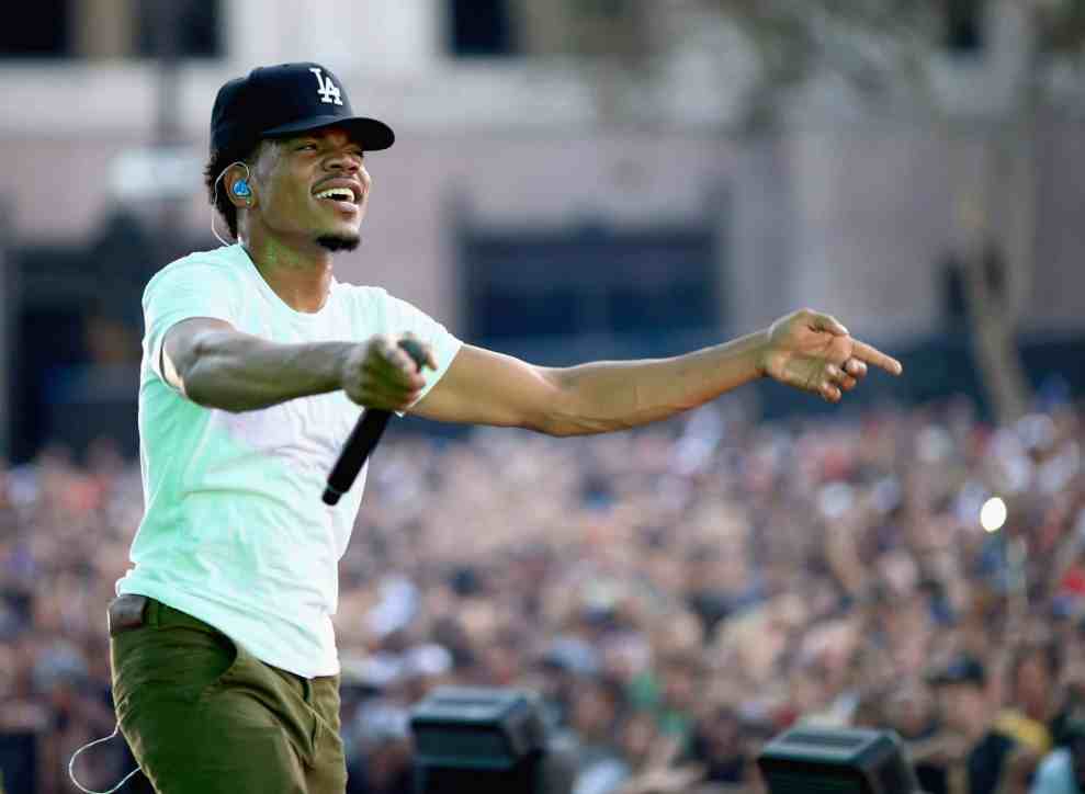 Chance the Rapper performing in black LA baseball cap