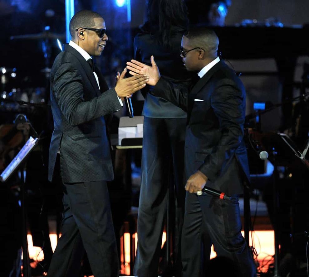 Nas and Jay Z high fiving on stage
