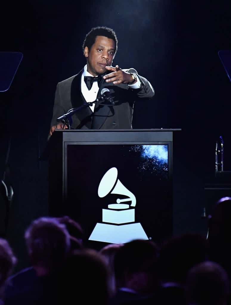 Jay Z accepts the President's Merit Award onstage during the Clive Davis and Recording Academy Pre-GRAMMY Gala