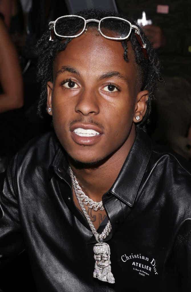 Rich the Kid wearing black looking at the camera