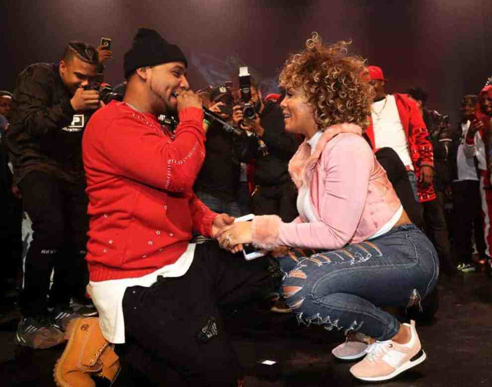 Juelz Santana (L) proposes to Kimberly Vanderhee onstage at The Apollo Theater on November 23
