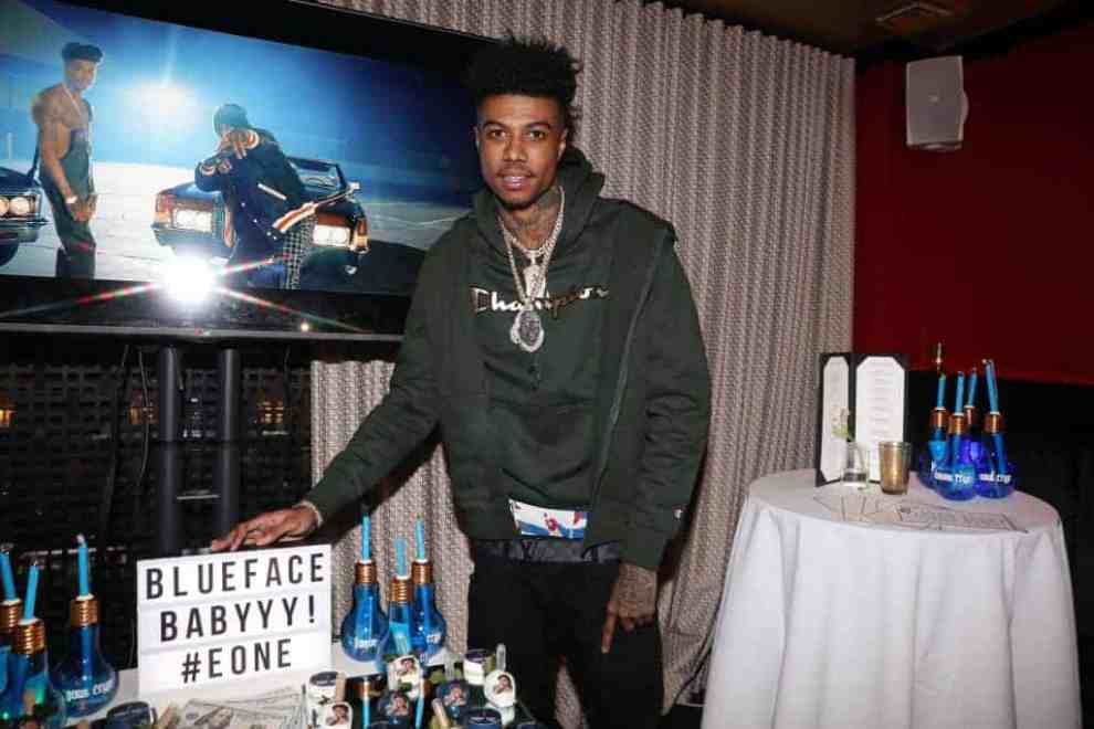 BlueFace wearing green facing the camera