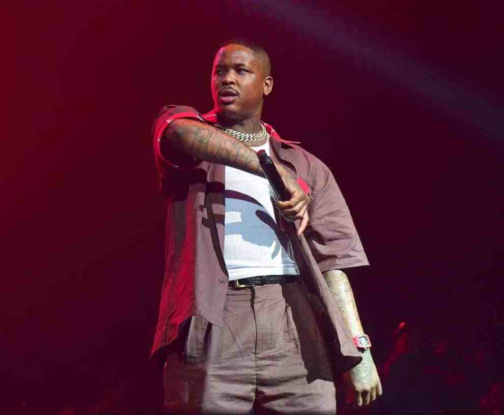 YG wearing red and white