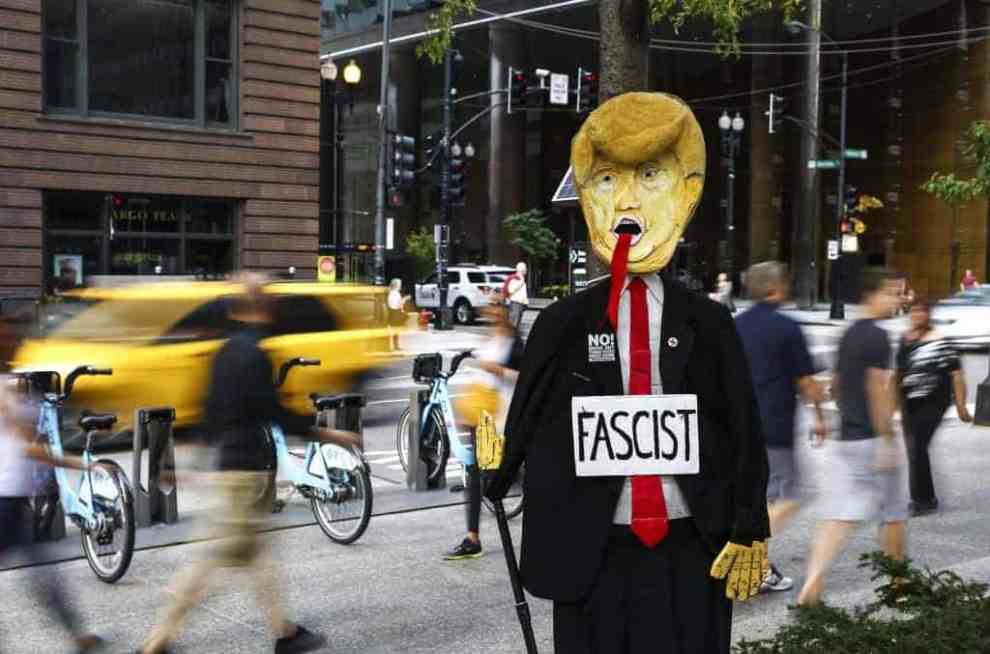 An effigy of U.S. President Donald J. Trump with 'No! Drive Out Trump/Pence Fascist Regime' written on is being displayed during