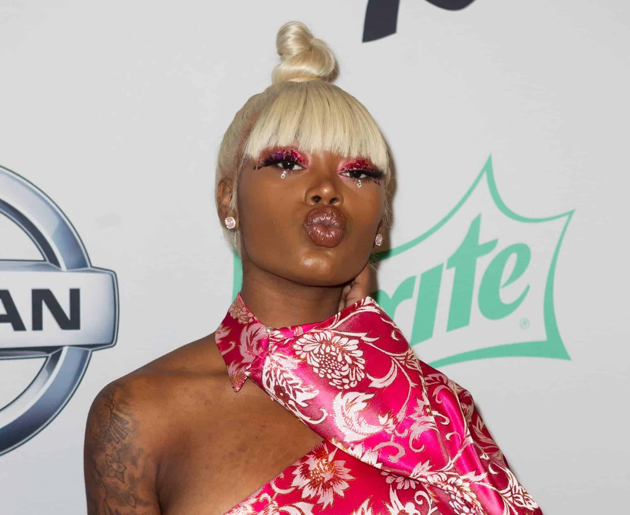 Asian Doll Claps Back At A Fan Who Criticized How Many King Von Tattoos She  Has