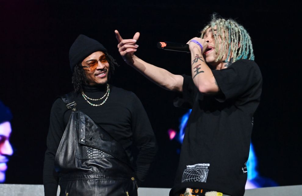 T.I. and King Harris perform onstage during 2023 V-103 Winterfest: Celebrating 50 Years of Hip Hop at State Farm Arena on December 15, 2023 in Atlanta, Georgia.