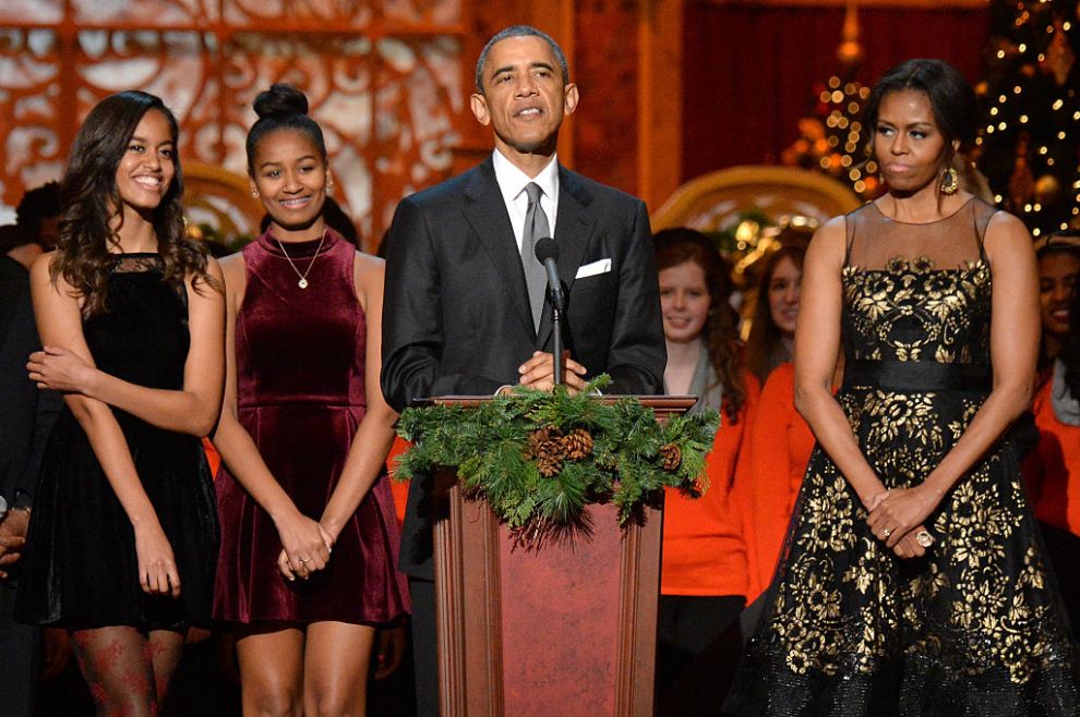 Malia Obama, Sasha Obama, U.S. President Barack Obama, and First Lady Michelle Obama speak onstage at TNT Christmas in Washington 2014 at the National Building Museum on December 14, 2014 in Washington, DC. 25248_002_1209.JPG