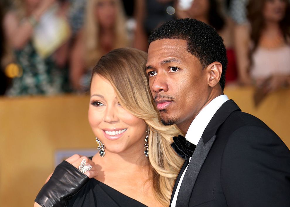 Mariah Carey and Nick Cannon (R) arrive at the 20th Annual Screen Actors Guild Awards at the Shrine Auditorium on January 18, 2014 in Los Angeles, California.